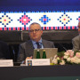 Foto do painel de 3 oradores sentados à mesa da conferência 33rd Homologues Group Meeting
