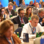 Plano focado nos 2 membros portugueses sentados na plateia da 33rd Homologues Group Meeting